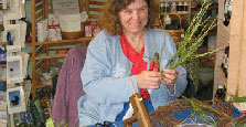 Ruth Greb demonstrating the making of wreaths.